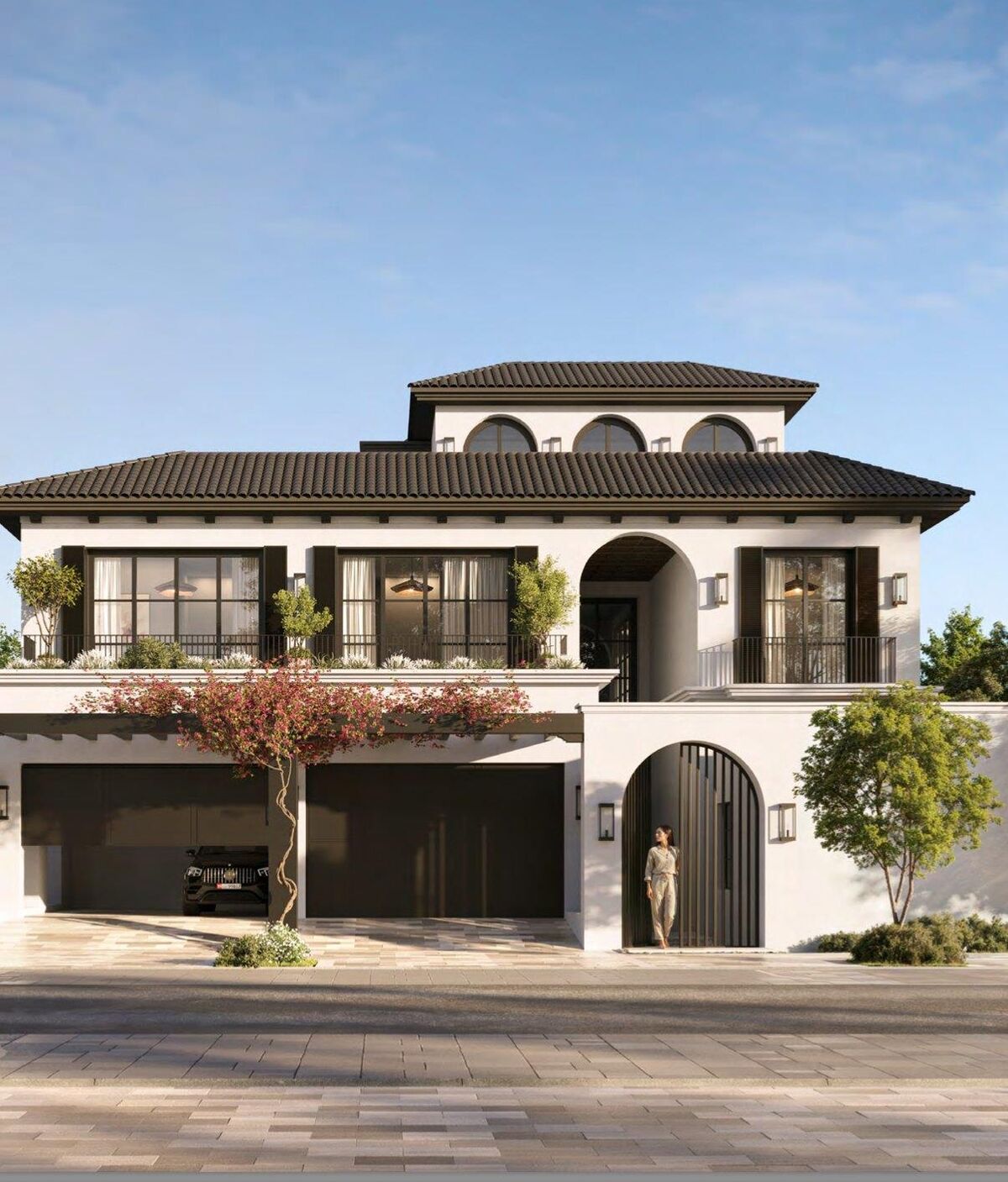 Fairway Villa street elevation: white render, terracotta roof tiles, arched entrance, double garage and a courtyard tree.